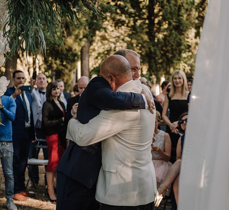 Wedding Ceremony | Groomsmen in Tuxedos | Super Luxe Blush, White & Greenery Destination Wedding at Villa Pitiana, Tuscany, Italy | Jason Mark Harris Photography | Angelo La Torre Film