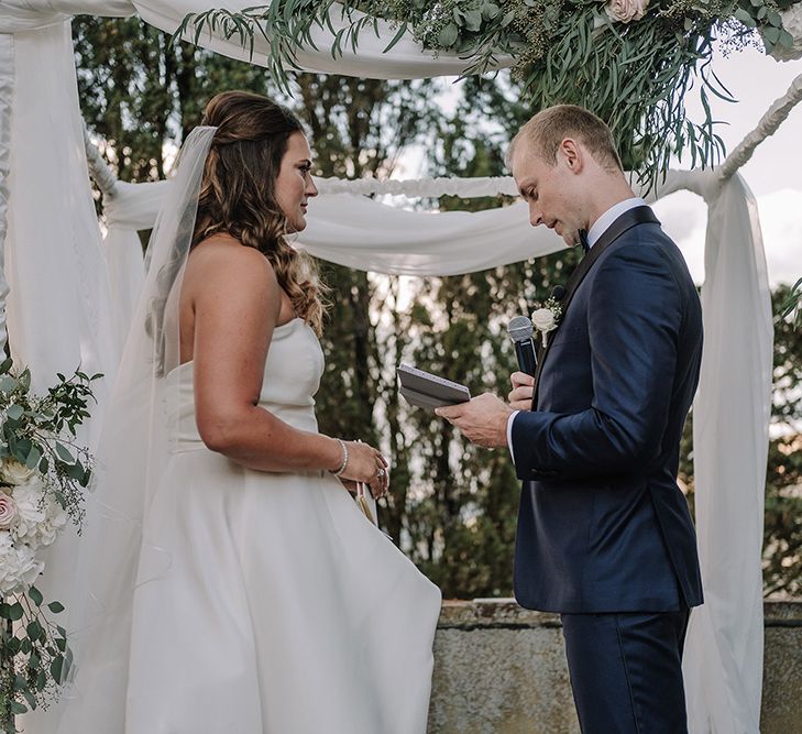 Wedding Ceremony | Bride in Monique Lhuillier Gown | Groom in Tuxedo | Super Luxe Blush, White & Greenery Destination Wedding at Villa Pitiana, Tuscany, Italy | Jason Mark Harris Photography | Angelo La Torre Film