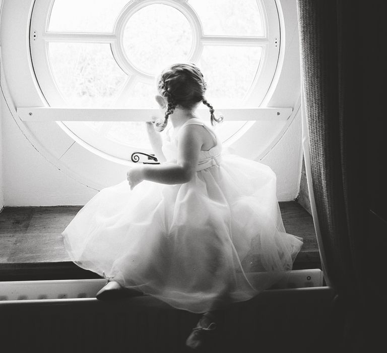 Flower Girl Sitting in the Window