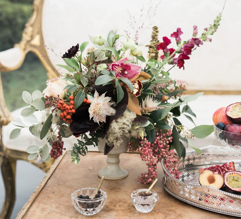 Elegant Sofa & Floral Arrangement | Autumnal Decadence Wedding Inspiration at Twyning Park Styled by For The Love of Weddings | Red, Gold & Blush Colour Scheme | Captured by Katrina Photography