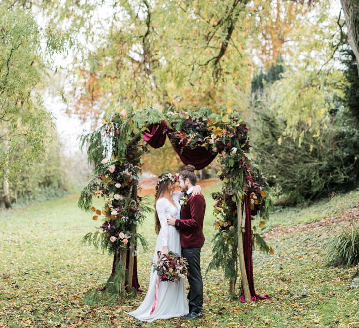 Woodland Floral Arch | Stylish Bride & Groom | Autumnal Decadence Wedding Inspiration at Twyning Park Styled by For The Love of Weddings | Red, Gold & Blush Colour Scheme | Captured by Katrina Photography