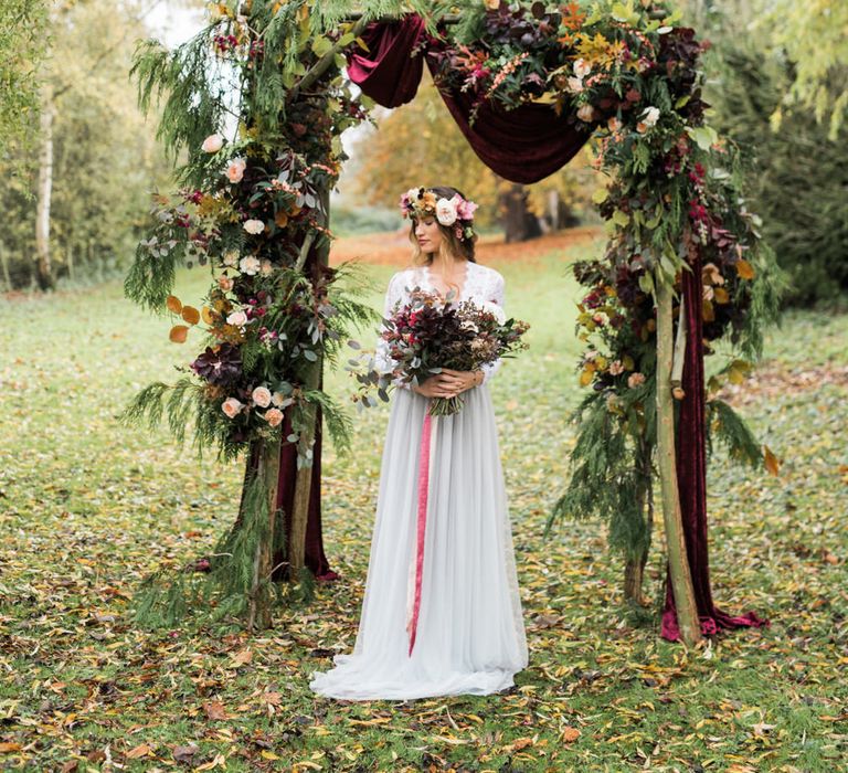 Woodland Floral Arch | Bride in Tulle | Autumnal Decadence Wedding Inspiration at Twyning Park Styled by For The Love of Weddings | Red, Gold & Blush Colour Scheme | Captured by Katrina Photography