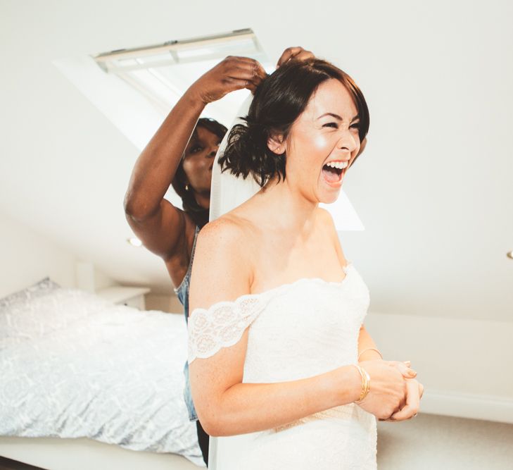 Bride Having Hair Done On Wedding Morning