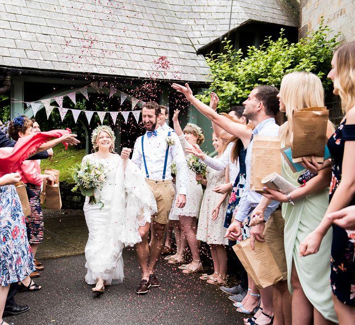 Confetti Moment | Bride in Lace Wedding Dress | Groom in Shorts, Braces & Bow Tie | Coastal Wedding at Driftwood Spas St Agnes, Cornwall | Jessica Grace Photography