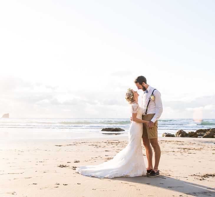 Beach Portrait | Bride in Lace Wedding Dress | Groom in Shorts, Braces & Bow Tie | Coastal Wedding at Driftwood Spas St Agnes, Cornwall | Jessica Grace Photography