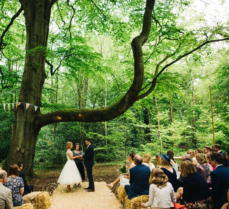 Bride in Short Blue by Enzoani Danbury Gown & Groom in Navy Ted Baker Suit