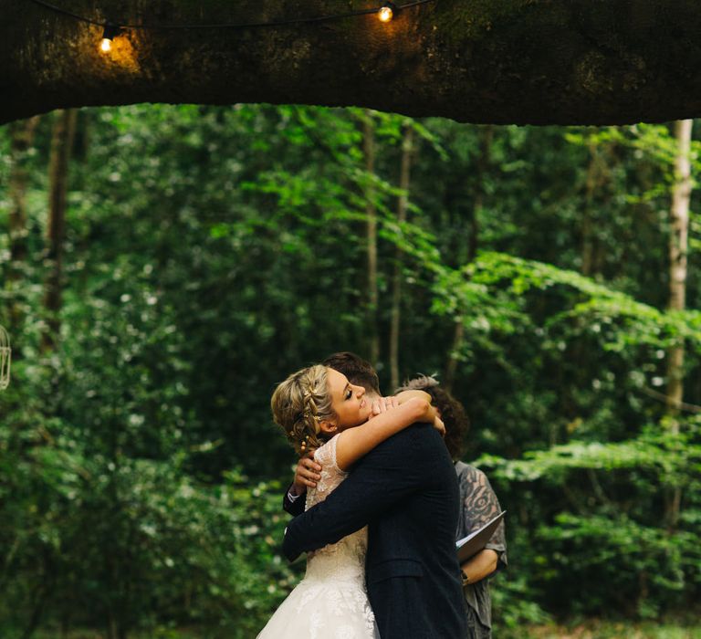 Bride in Short Blue by Enzoani Danbury Gown & Groom in Navy Ted Baker Suit