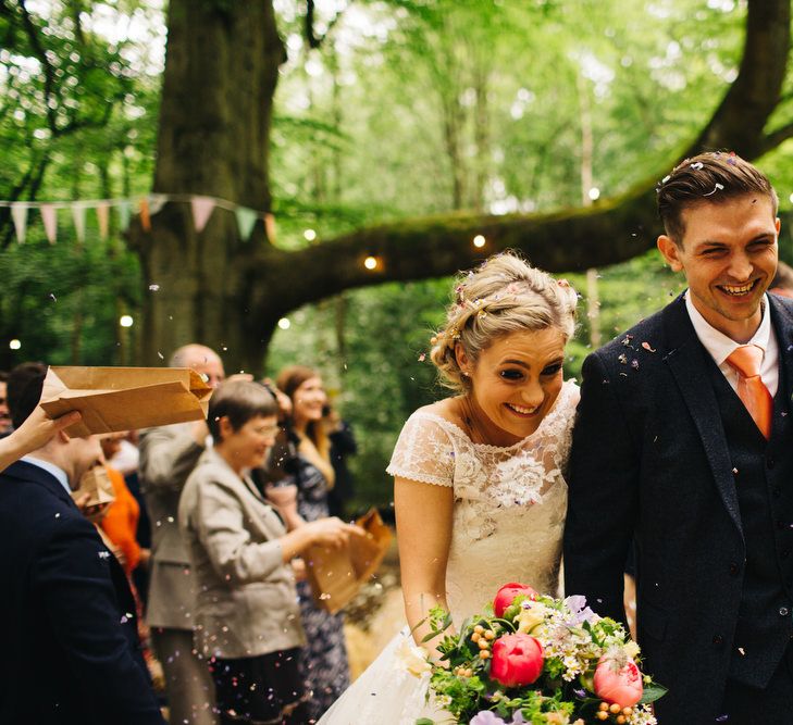 Bride in Short Blue by Enzoani Danbury Gown & Groom in Navy Ted Baker Suit