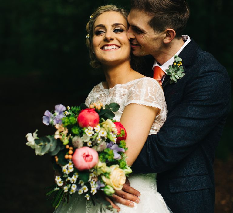 Bride in Short Blue by Enzoani Danbury Gown & Groom in Navy Ted Baker Suit