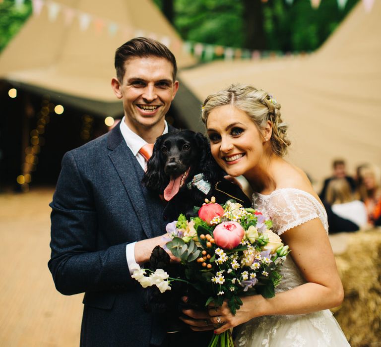 Bride in Short Blue by Enzoani Danbury Gown & Groom in Navy Ted Baker Suit with Pet Dog