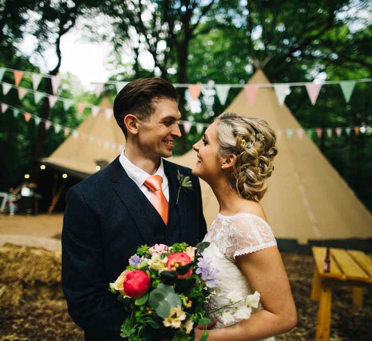 Bride in Short Blue by Enzoani Danbury Gown & Groom in Navy Ted Baker Suit