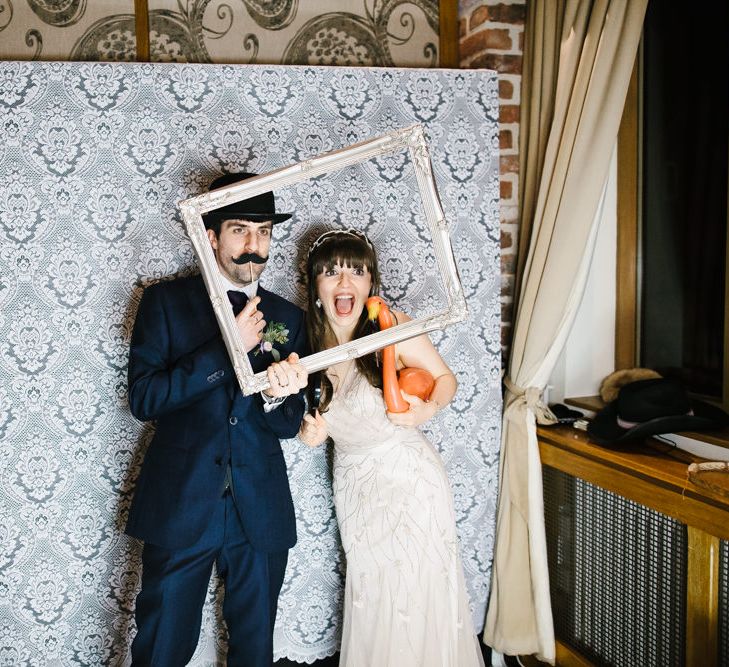 Photo Booth | Bride in Sequin Wedding Dress | Delicate Victoria Millésime Headpiece | Groom in Moss Bros Hire Suit | Curradine Barns, West Midlands | Chris Barber Photography