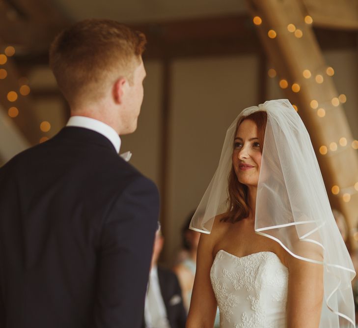 Bride in Stewart Parving Gown & Groom in Reiss Suit Sandburn Hall Yorkshire Wedding Ceremony