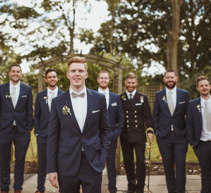 Groom in Reiss Suit & Groomsmen in Moss Bros Suits