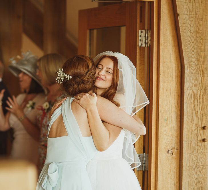 Bride in Stewart Parvin & Bridesmaid in Pastel Monsoon Dress