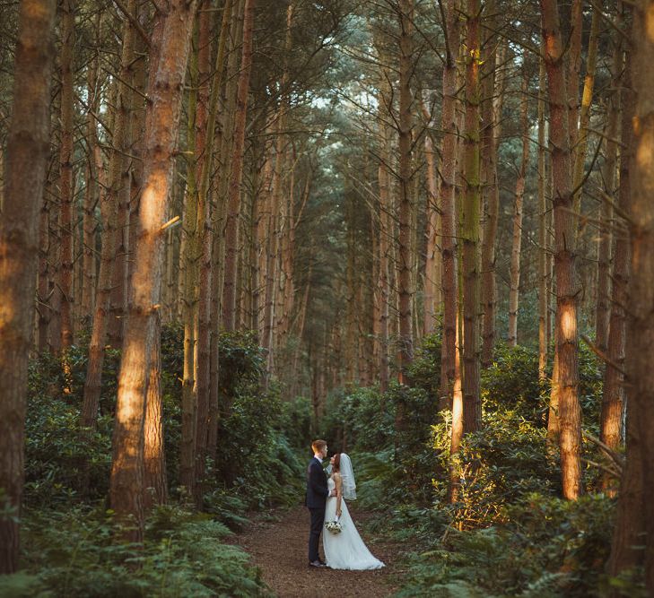 Bride in Stewart Parving Gown & Groom in Reiss Suit at Griffon Forrest in Yorkshire