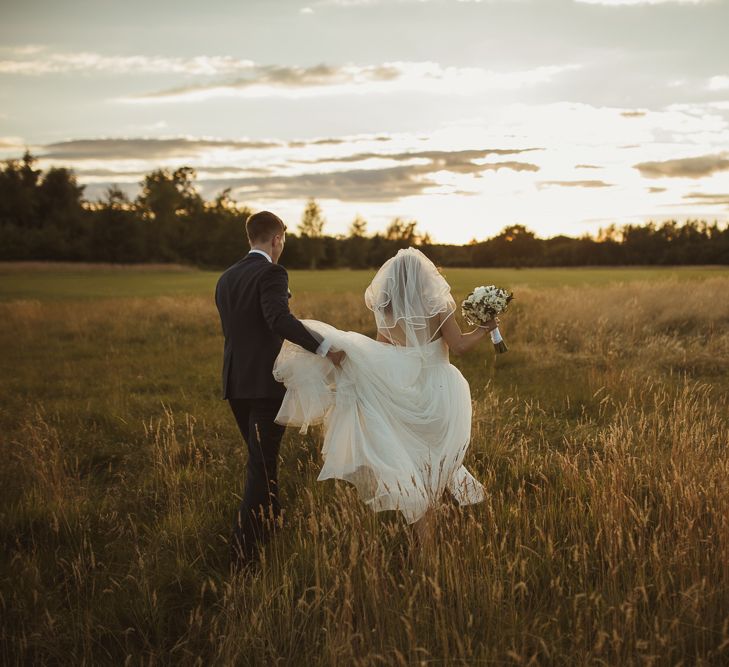 Bride in Stewart Parving Gown & Groom in Reiss Suit at Griffon Forrest in Yorkshire