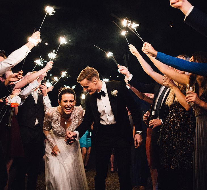 Sparkler Moment with Bride in Camellia Suzanne Neville Gown & Groom in SuitSupply Tuxedo