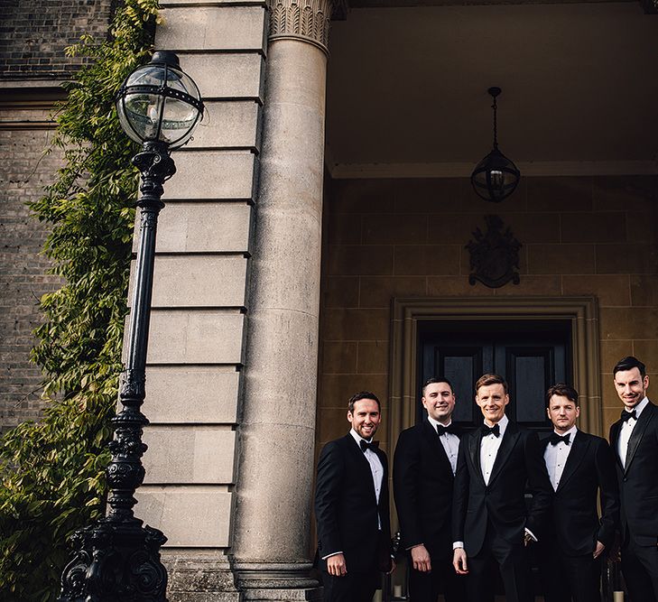 Groomsmen in Black Suitsupply Tuxedos