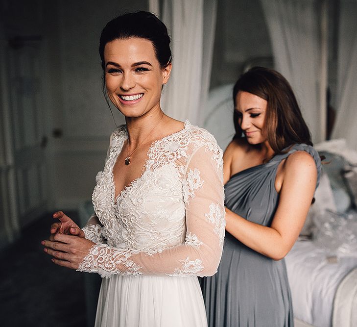 Bride in Camellia Suzanne Neville Gown & Bridesmaid in Charcoal Twobirds gown