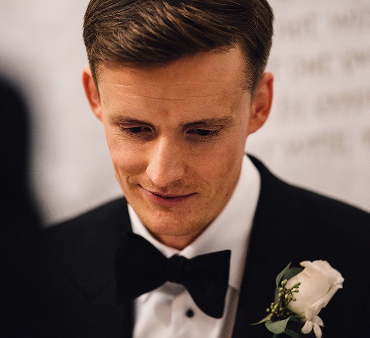 Groom in Black Suit Supply Tuxedo