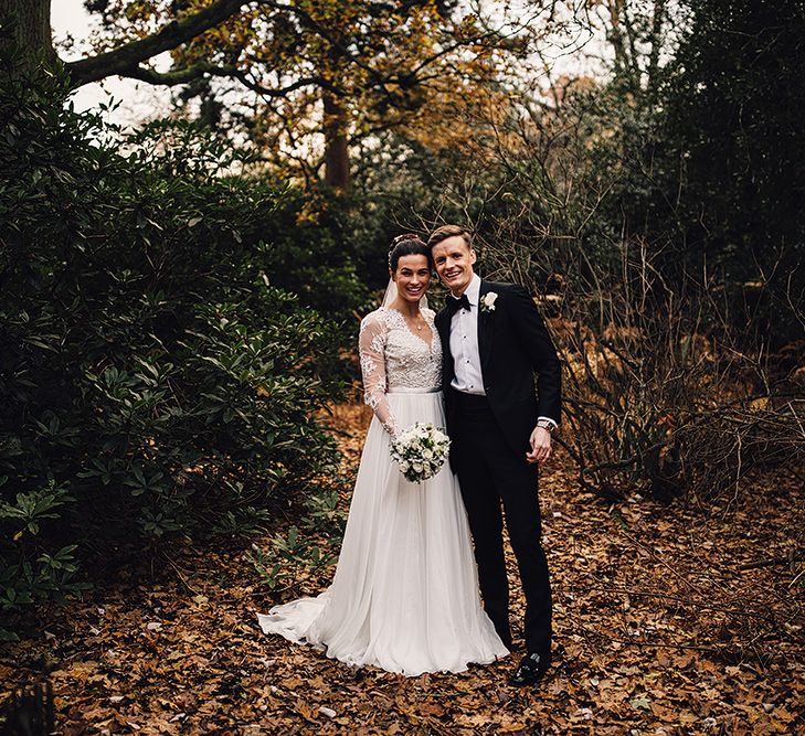 Bride in Camellia Suzanne Neville Gown & Groom in SuitSupply Tuxedo