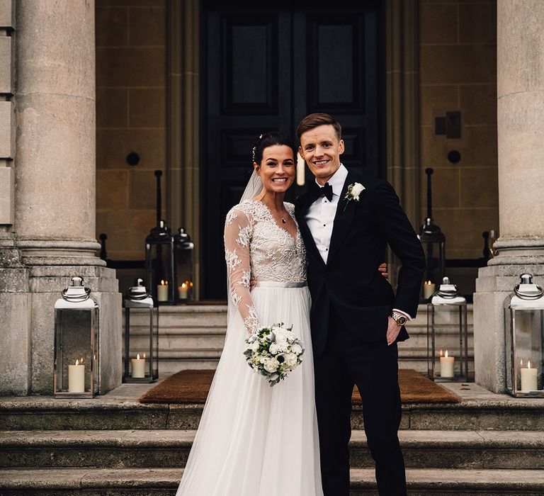 Bride in Camellia Suzanne Neville Gown & Groom in SuitSupply Tuxedo