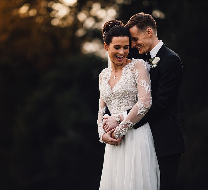 Bride in Camellia Suzanne Neville Gown & Groom in SuitSupply Tuxedo