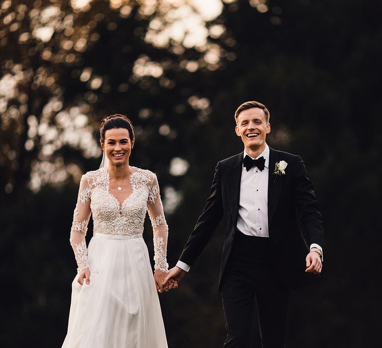 Bride in Camellia Suzanne Neville Gown & Groom in SuitSupply Tuxedo