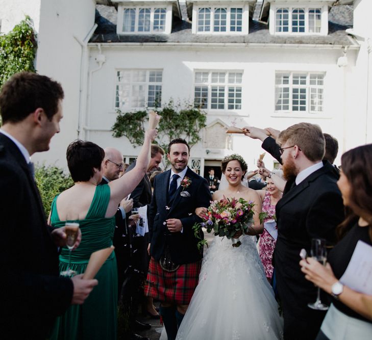 Confetti Exit | Bride in Modeca Bridal Gown | Groom in Tartan Kilt | Woodland Themed Wedding at Achnagairn Estate near Inverness, Scotland | Zoe Alexander Photography