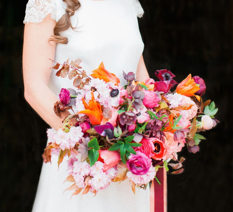 Brightly Coloured Bridal Bouquet And Jesus Peiro Gown For An Elegant Barn Wedding