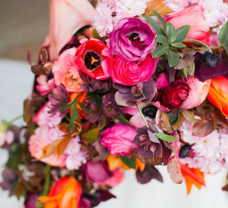 Brightly Coloured Bridal Bouquet And Jesus Peiro Gown For An Elegant Barn Wedding