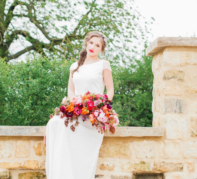 Brightly Coloured Bridal Bouquet And Jesus Peiro Gown For An Elegant Barn Wedding