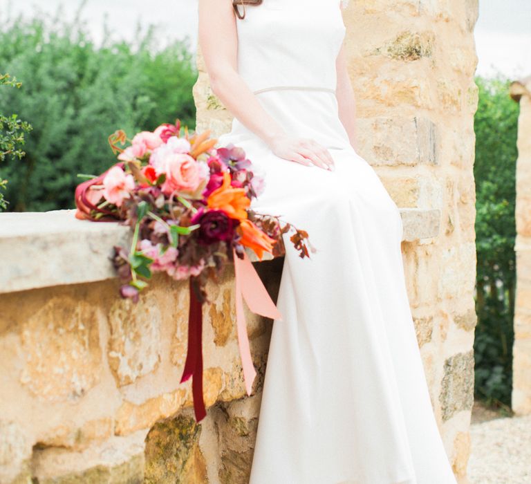 Brightly Coloured Bridal Bouquet And Jesus Peiro Gown For An Elegant Barn Wedding