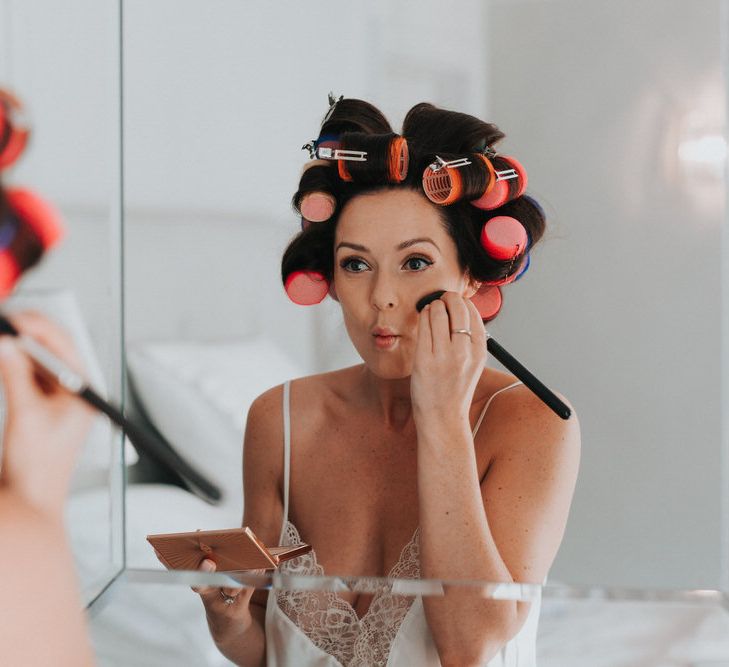 Bride Getting Ready For Wedding With Hair Rollers