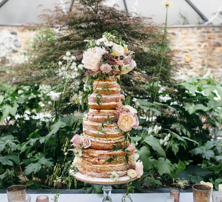 Naked Wedding Cake Covered In Flowers