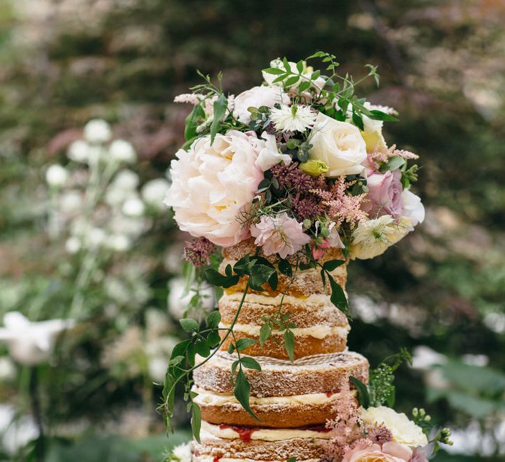 Naked Wedding Cake Covered In Flowers