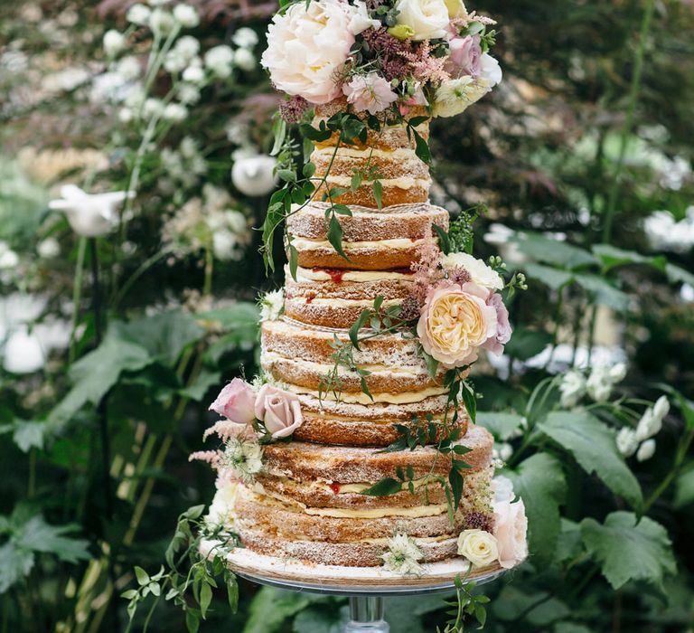 Naked Wedding Cake Covered In Flowers