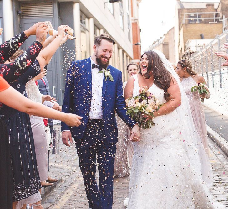 Confetti Shot | Bride in Lace Oleg Cassini Wedding Dress from Davids Bridal | Groom in River Island Suit | Kirsty Mackenzie Photography | Insta Wedding Films