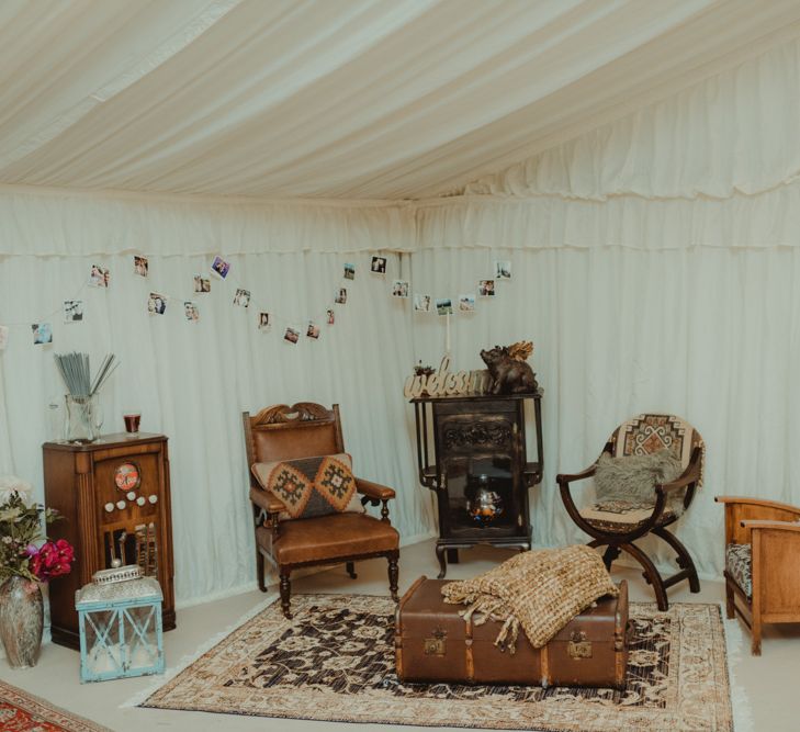 Vintage Furniture Seating Area In Marquee For Wedding