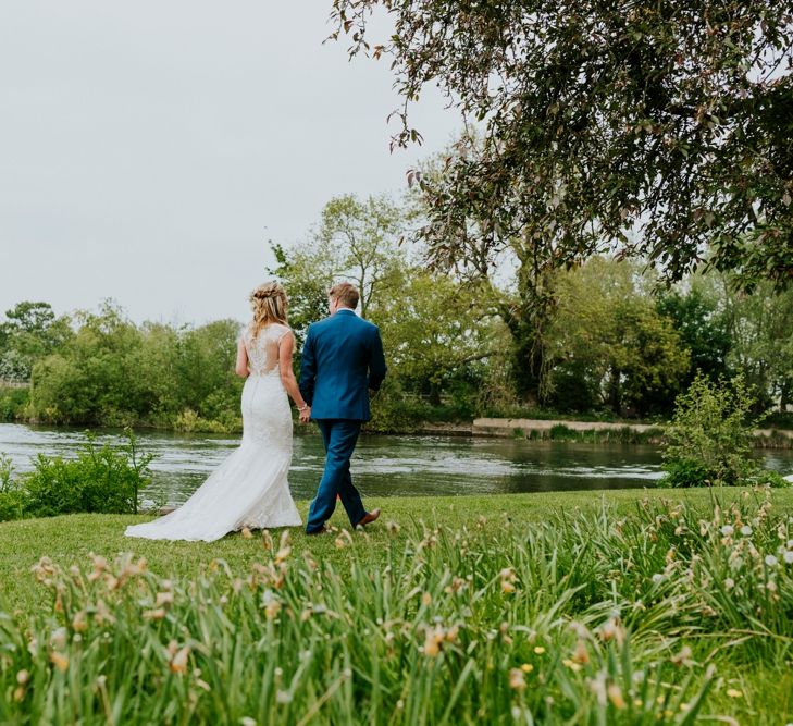 Bride in Lace Lillian West Wedding Dress | Groom in T.M Lewin Navy Suit | Benjamin Stuart Photography