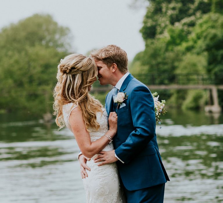 Bride in Lace Lillian West Wedding Dress | Groom in T.M Lewin Navy Suit | Benjamin Stuart Photography