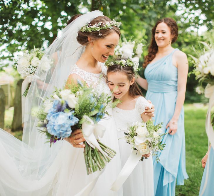 Bride in Lace Bodice & Ingrida Bridal Wedding Dress with Blue & White Hydrangea & Stock Bouquet