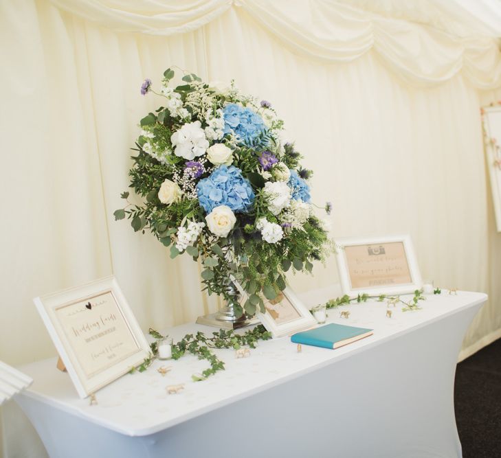 Guest Table with Blue & white Floral Arrangement