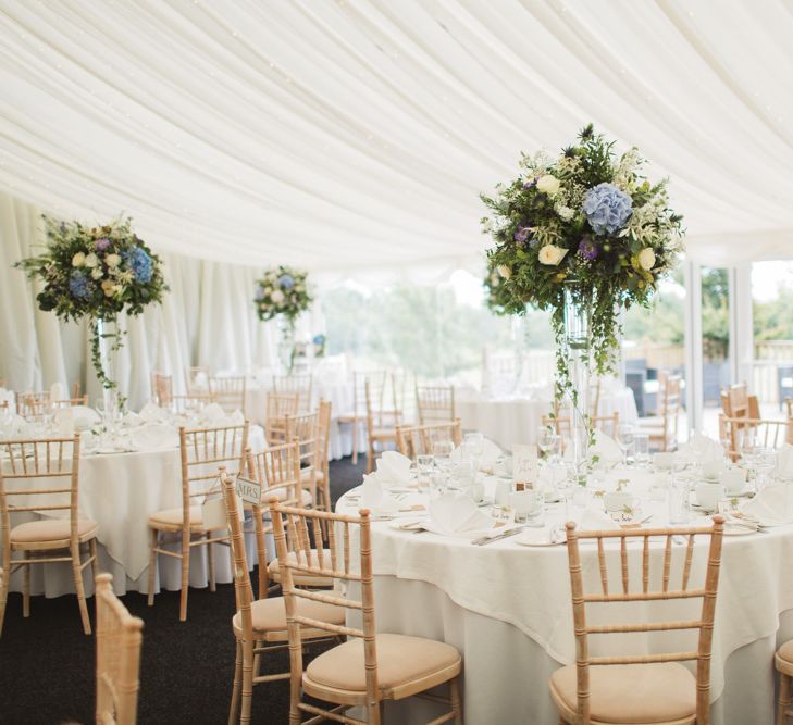 Marquee Wedding Breakfast Reception with Tall Blue & White Floral Centrepieces