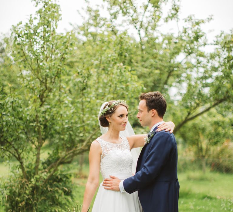 Bride in Lace Bodice & Ingrida Bridal Wedding Dress with Blue & White Hydrangea & Stock Bouquet and Groom in Traditional Morning Suit