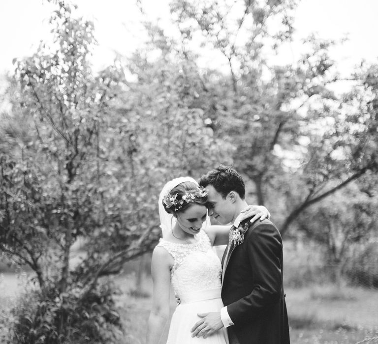 Bride in Lace Bodice & Ingrida Bridal Wedding Dress with Blue & White Hydrangea & Stock Bouquet and Groom in Traditional Morning Suit