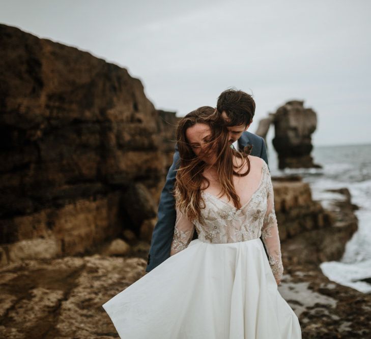 After Wedding Portraits at Portland Bill, Dorset | Bride in Miss Hayley Paige Bridal Gown | Groom in Navy Ted Baker Suit | Green Antlers Photography | Gione Da Silva Film