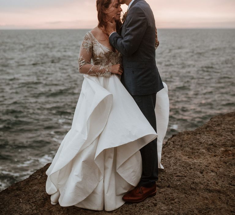 After Wedding Portraits at Portland Bill, Dorset | Bride in Miss Hayley Paige Bridal Gown | Groom in Navy Ted Baker Suit | Green Antlers Photography | Gione Da Silva Film