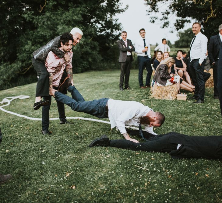 Tug of War | Fishley Hall Rustic Barn Wedding | Darina Stoda Photography